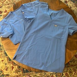 Two XS Catrina scrub tops in Ceil Blue